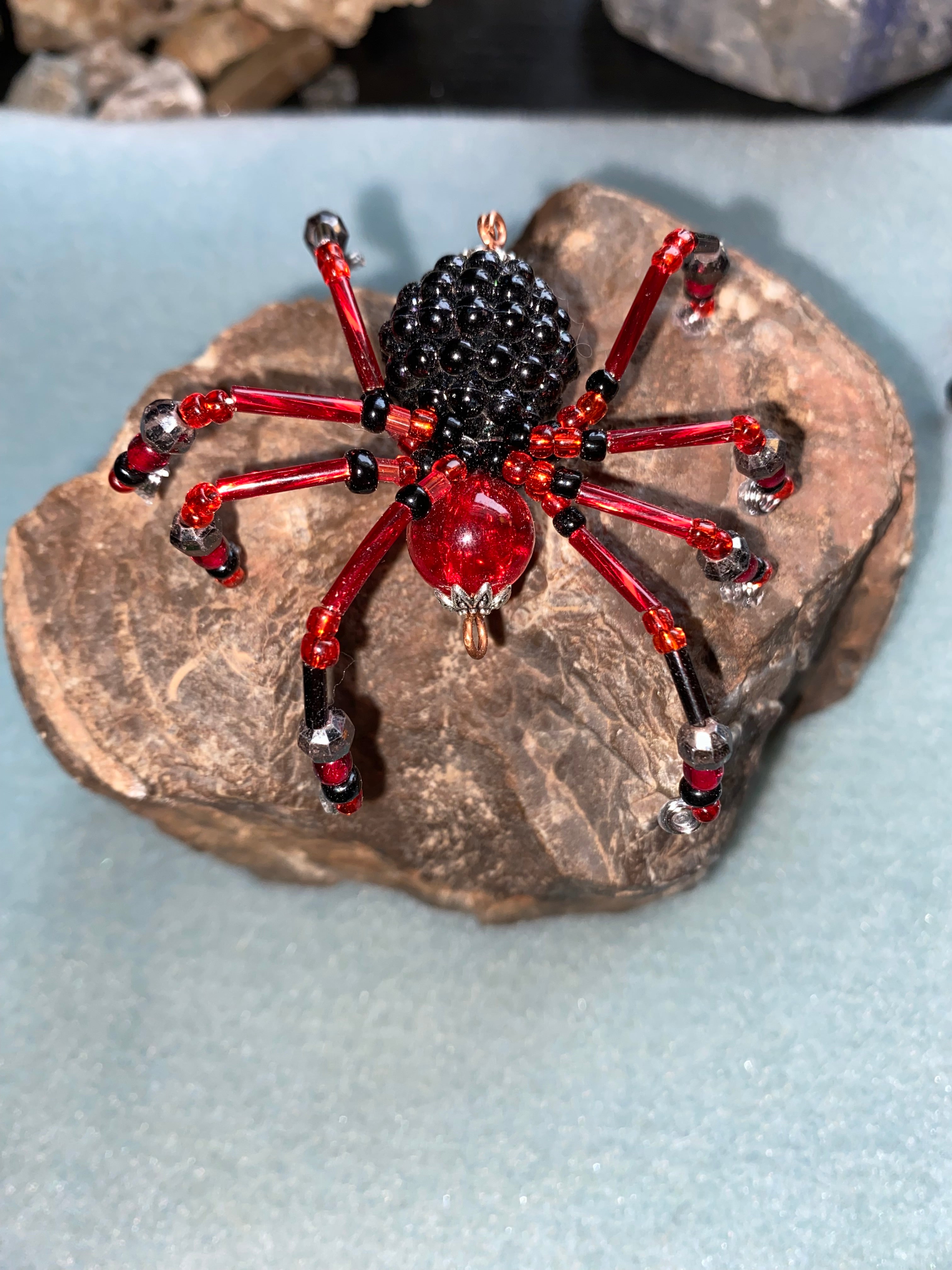 Red and black beaded spider