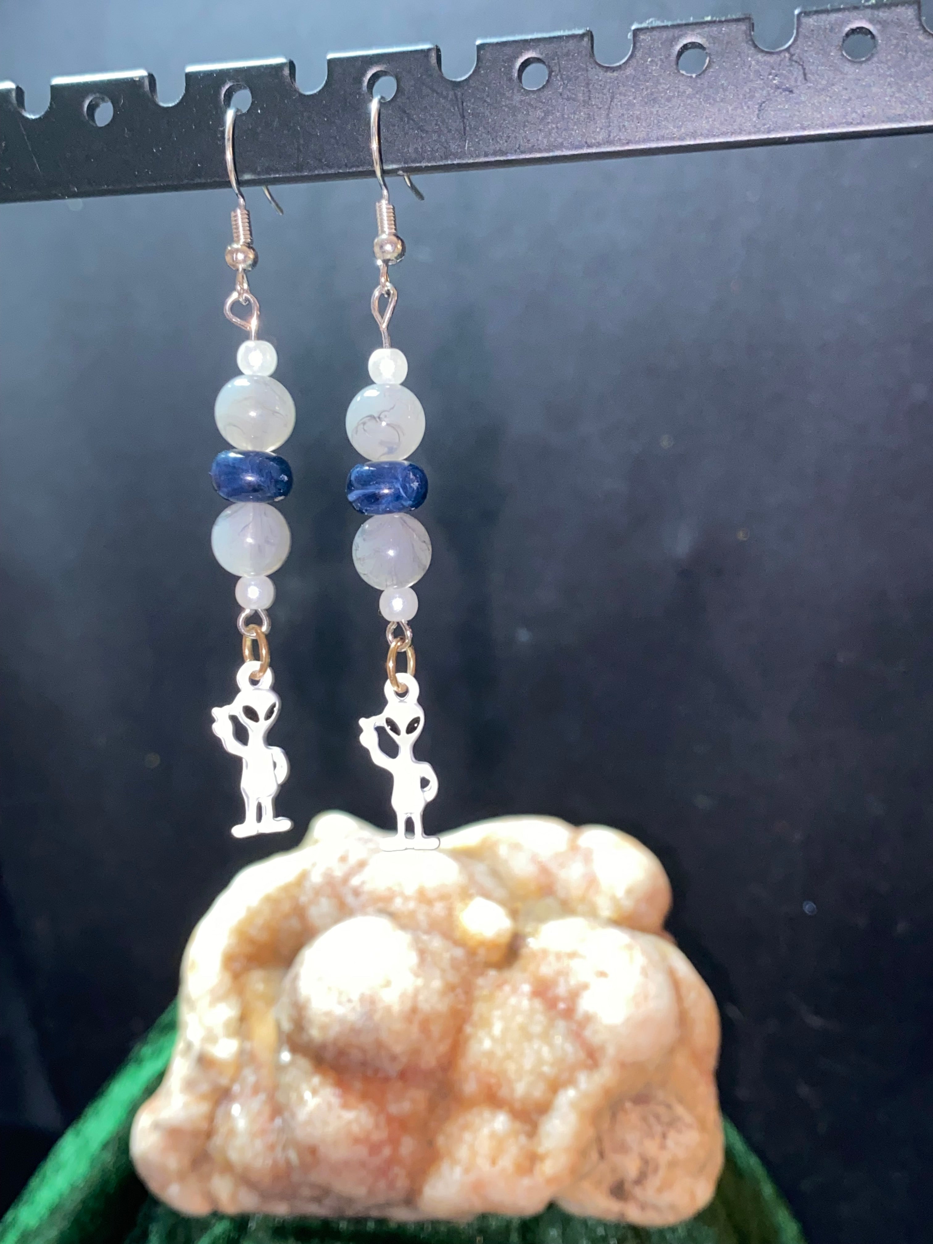 White alien earrings