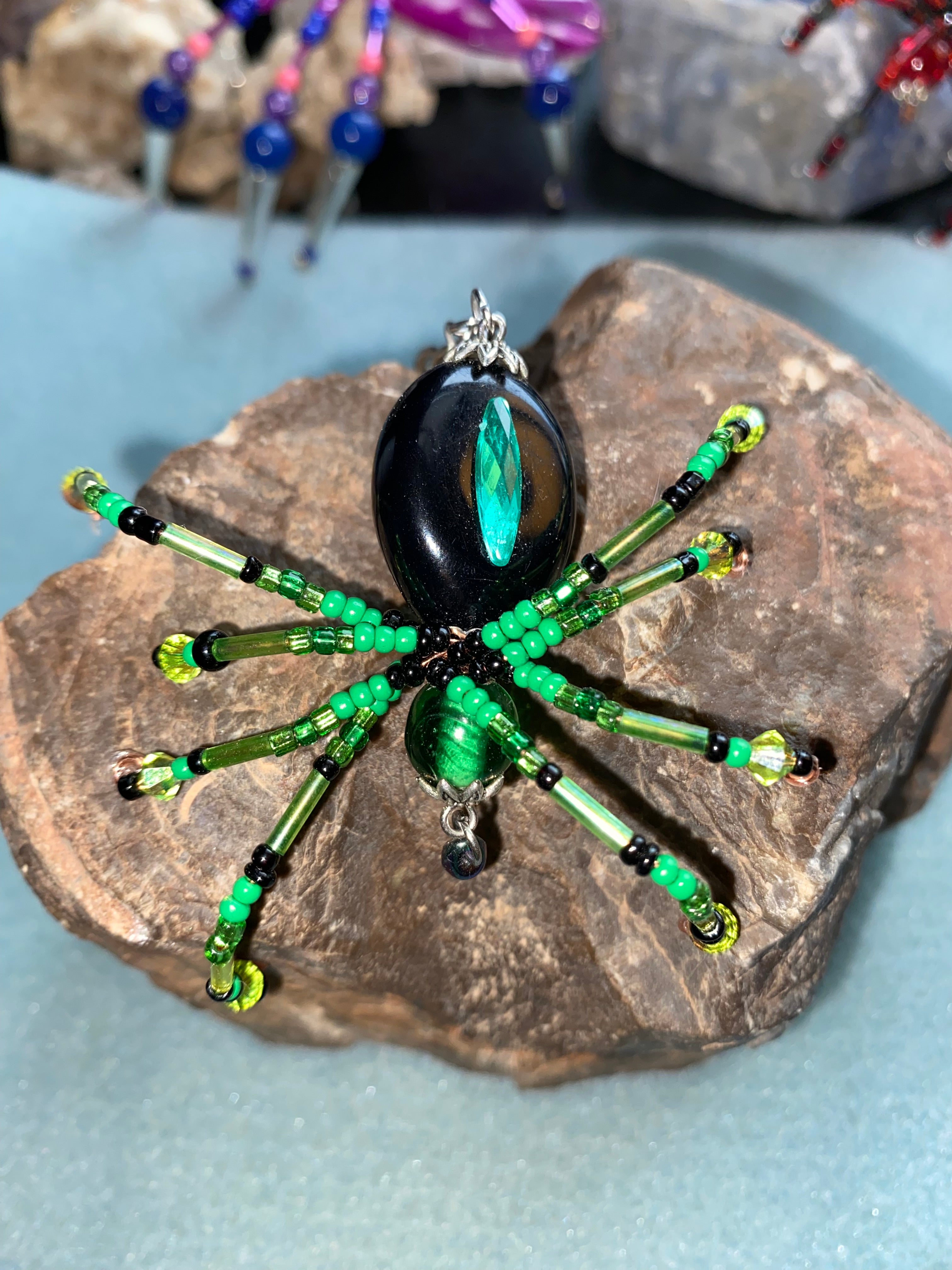 Black and green beaded spider