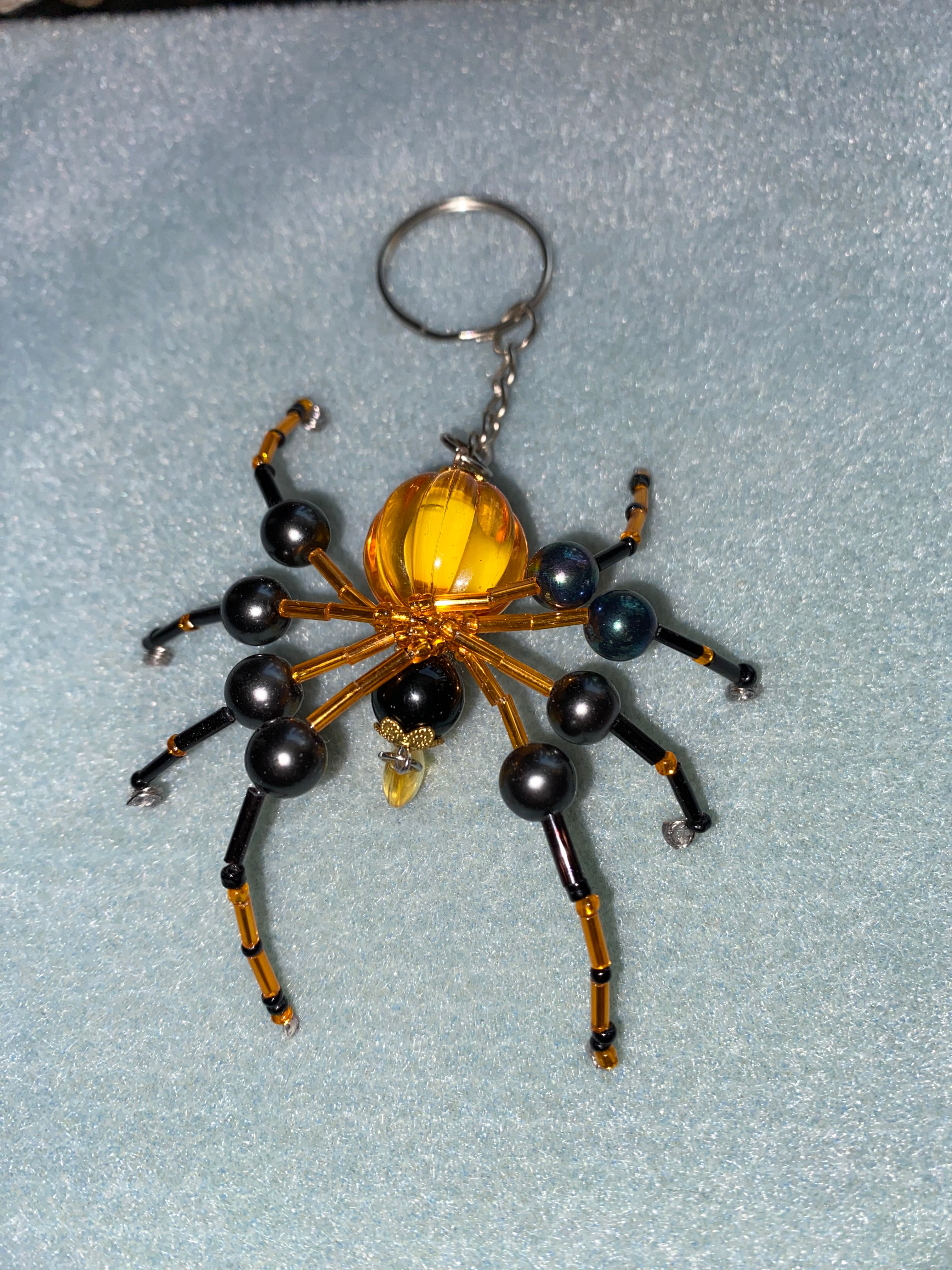 Black and orange beaded spider