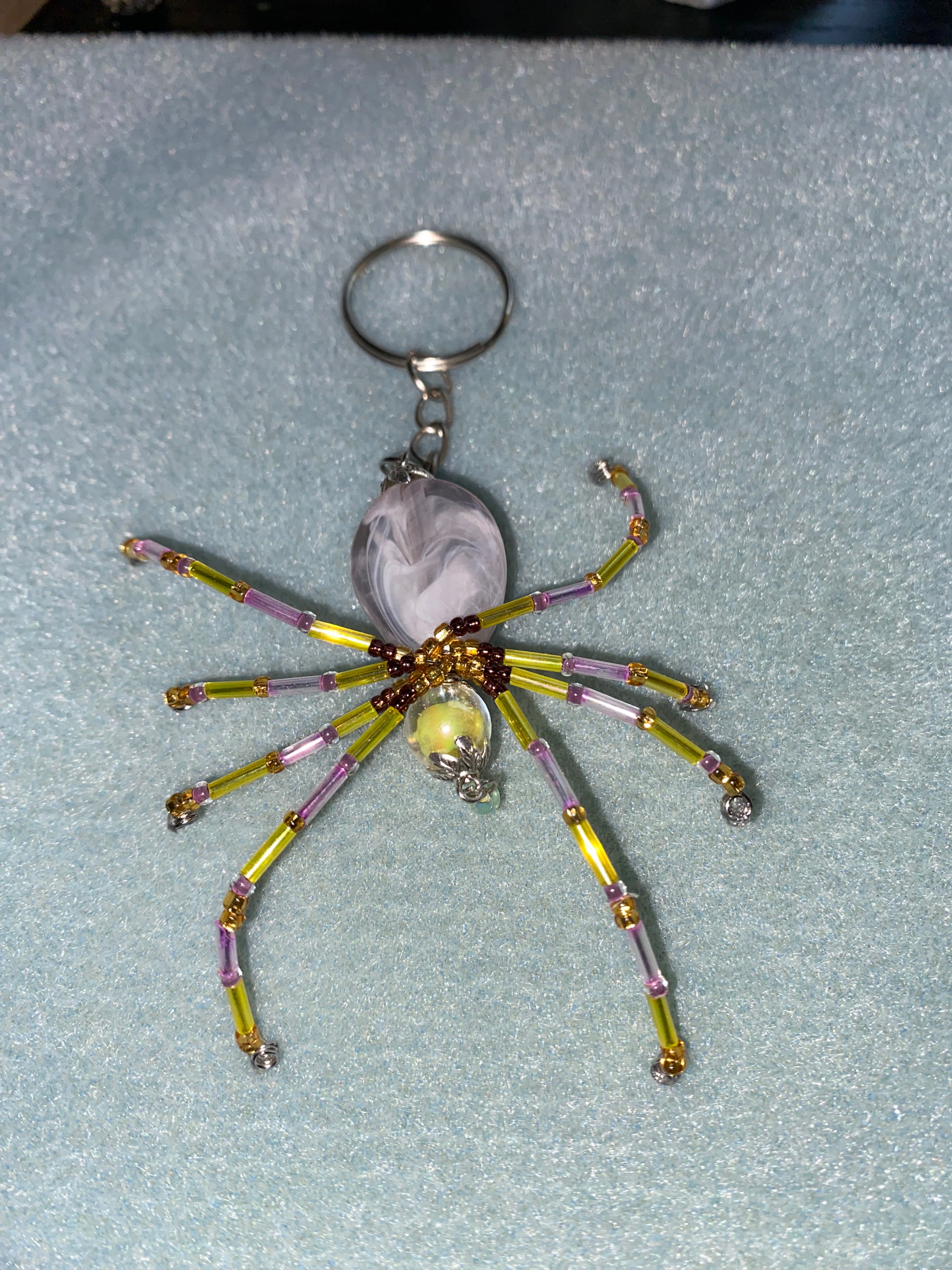 Purple and yellow beaded spider